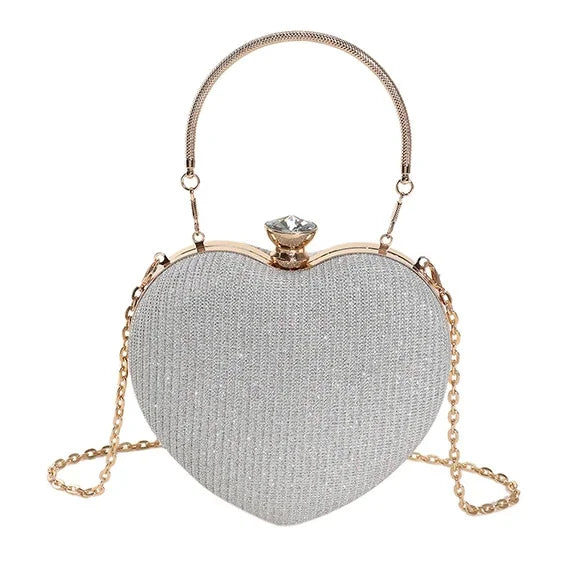 Bolso de metal brillante con forma de corazón